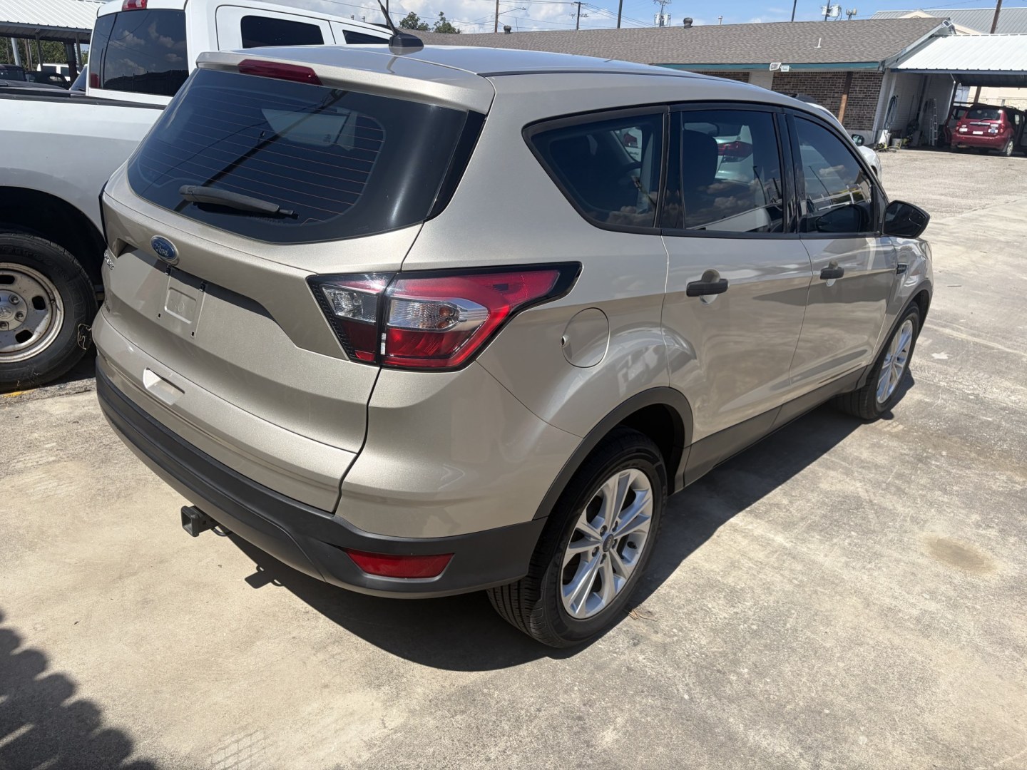 2018 Gold Ford Escape S FWD (1FMCU0F78JU) with an 2.5L L4 DOHC 16V engine, 6A transmission, located at 1687 Business 35 S, New Braunfels, TX, 78130, (830) 625-7159, 29.655487, -98.051491- Photo#6