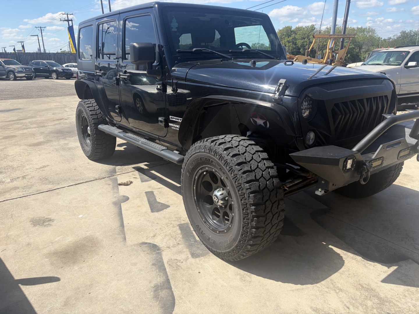 2014 Black Jeep Wrangler Unlimited Sport 4WD (1C4BJWDG5EL) with an 3.6L V6 DOHC 24V FFV engine, located at 1687 Business 35 S, New Braunfels, TX, 78130, (830) 625-7159, 29.655487, -98.051491- Photo#2