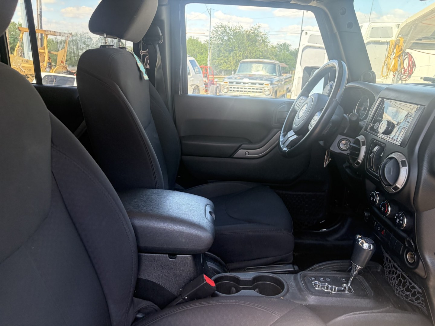 2014 Black Jeep Wrangler Unlimited Sport 4WD (1C4BJWDG5EL) with an 3.6L V6 DOHC 24V FFV engine, located at 1687 Business 35 S, New Braunfels, TX, 78130, (830) 625-7159, 29.655487, -98.051491- Photo#3