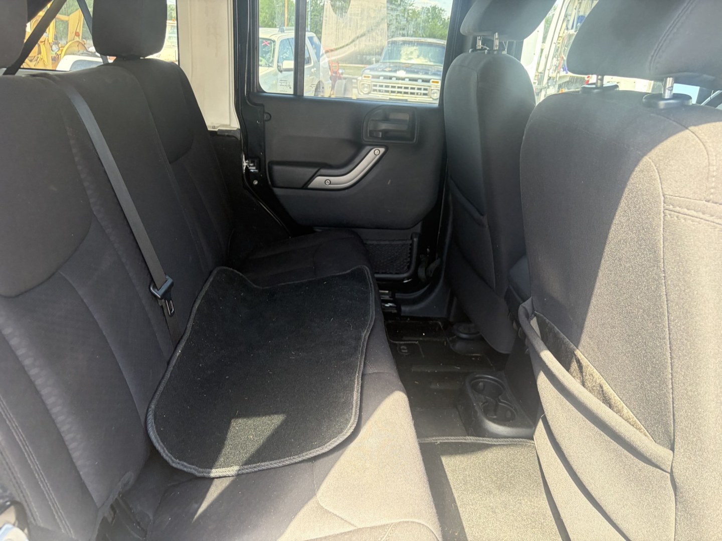 2014 Black Jeep Wrangler Unlimited Sport 4WD (1C4BJWDG5EL) with an 3.6L V6 DOHC 24V FFV engine, located at 1687 Business 35 S, New Braunfels, TX, 78130, (830) 625-7159, 29.655487, -98.051491- Photo#5