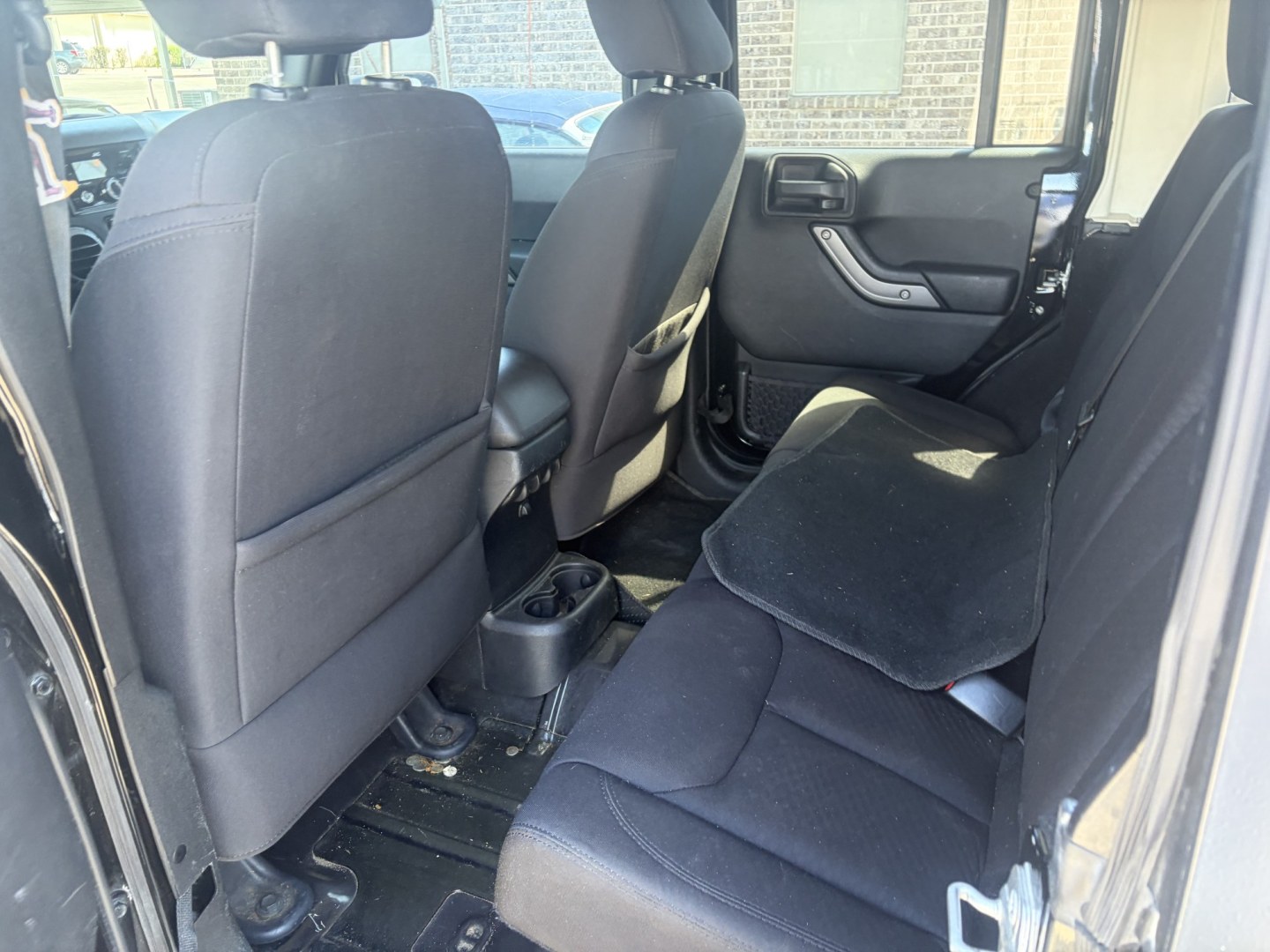 2014 Black Jeep Wrangler Unlimited Sport 4WD (1C4BJWDG5EL) with an 3.6L V6 DOHC 24V FFV engine, located at 1687 Business 35 S, New Braunfels, TX, 78130, (830) 625-7159, 29.655487, -98.051491- Photo#8
