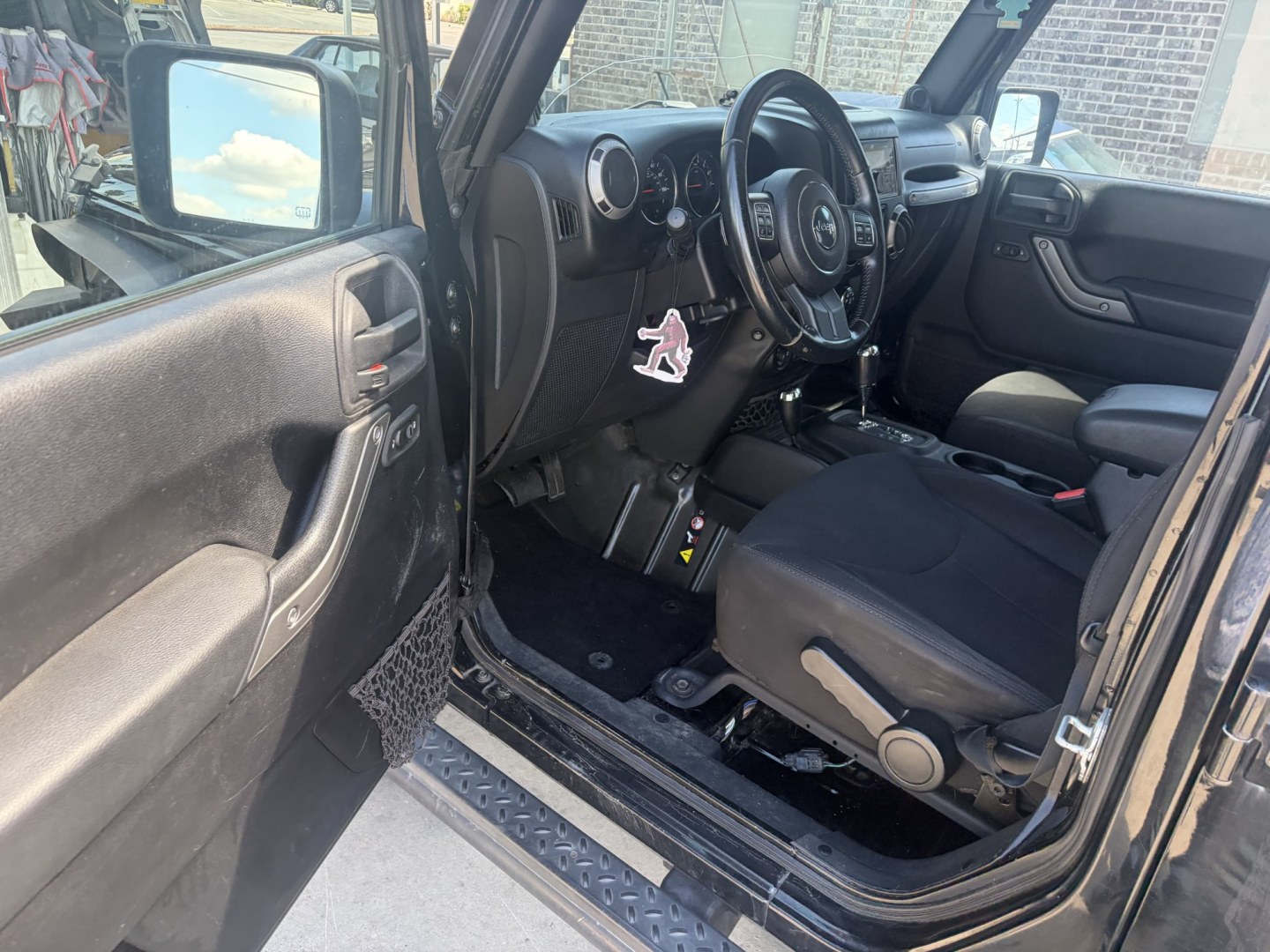 2014 Black Jeep Wrangler Unlimited Sport 4WD (1C4BJWDG5EL) with an 3.6L V6 DOHC 24V FFV engine, located at 1687 Business 35 S, New Braunfels, TX, 78130, (830) 625-7159, 29.655487, -98.051491- Photo#9