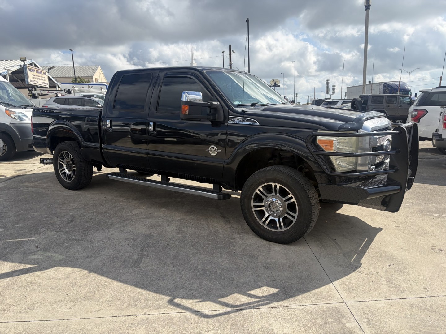 2015 Black Ford F-250 SD Lariat Crew Cab 4WD (1FT7W2BT9FE) with an 6.7L V8 OHV 16V DIESEL engine, 6-Speed Automatic transmission, located at 1687 Business 35 S, New Braunfels, TX, 78130, (830) 625-7159, 29.655487, -98.051491- Photo#1
