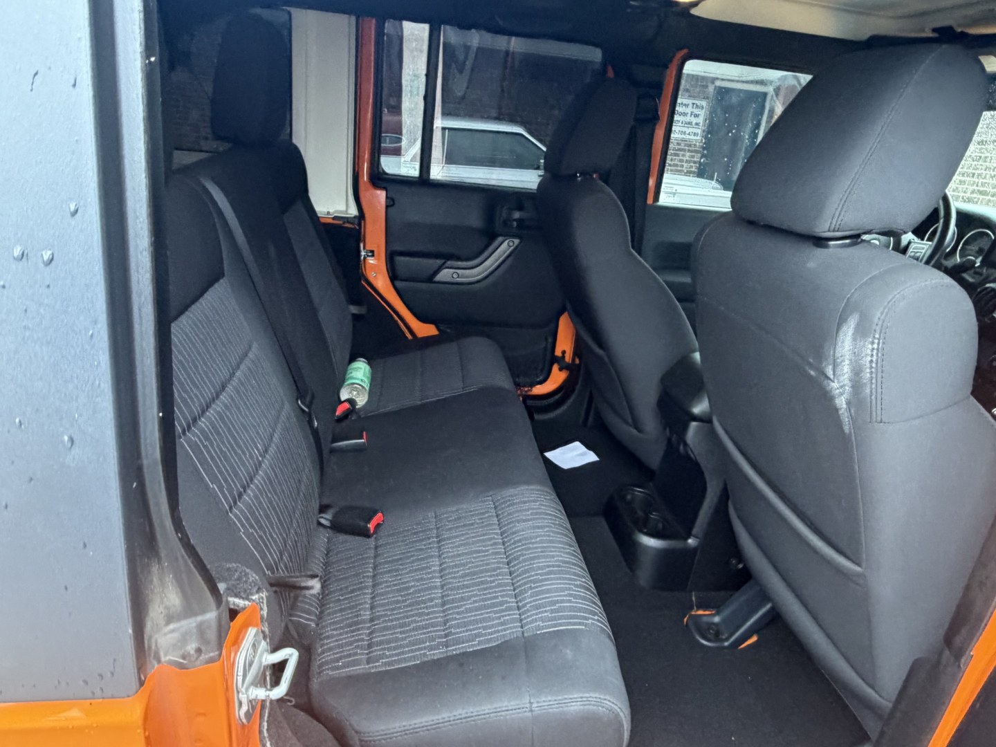 2012 Orange Jeep Wrangler Unlimited Sport 4WD (1C4BJWDGXCL) with an 3.6L V6 DOHC 24V FFV engine, located at 1687 Business 35 S, New Braunfels, TX, 78130, (830) 625-7159, 29.655487, -98.051491- Photo#4