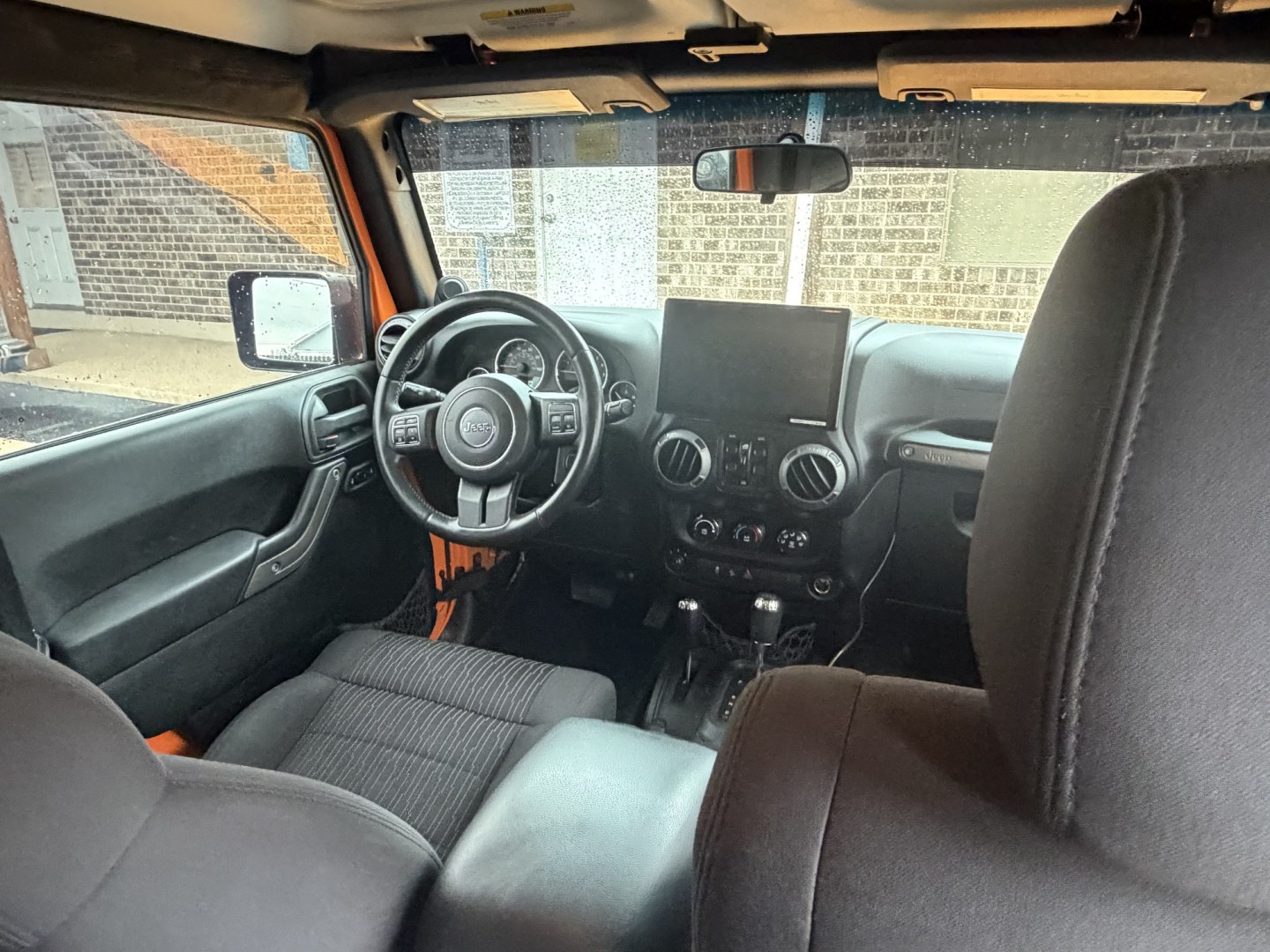 2012 Orange Jeep Wrangler Unlimited Sport 4WD (1C4BJWDGXCL) with an 3.6L V6 DOHC 24V FFV engine, located at 1687 Business 35 S, New Braunfels, TX, 78130, (830) 625-7159, 29.655487, -98.051491- Photo#5