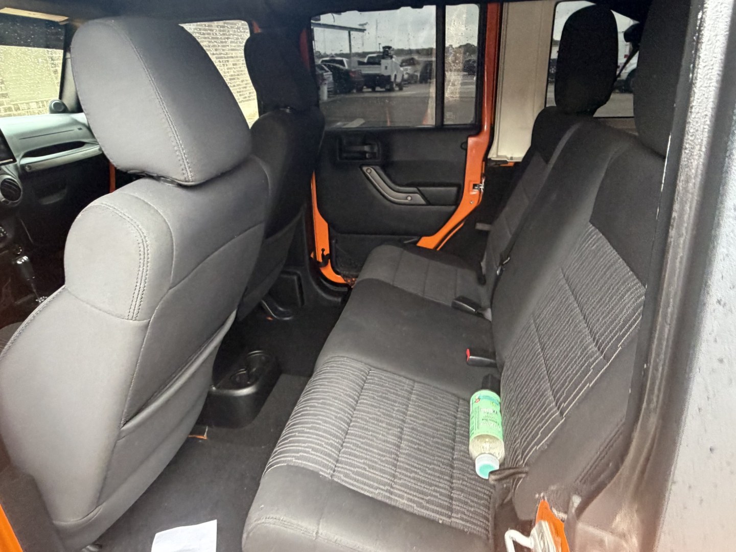 2012 Orange Jeep Wrangler Unlimited Sport 4WD (1C4BJWDGXCL) with an 3.6L V6 DOHC 24V FFV engine, located at 1687 Business 35 S, New Braunfels, TX, 78130, (830) 625-7159, 29.655487, -98.051491- Photo#8