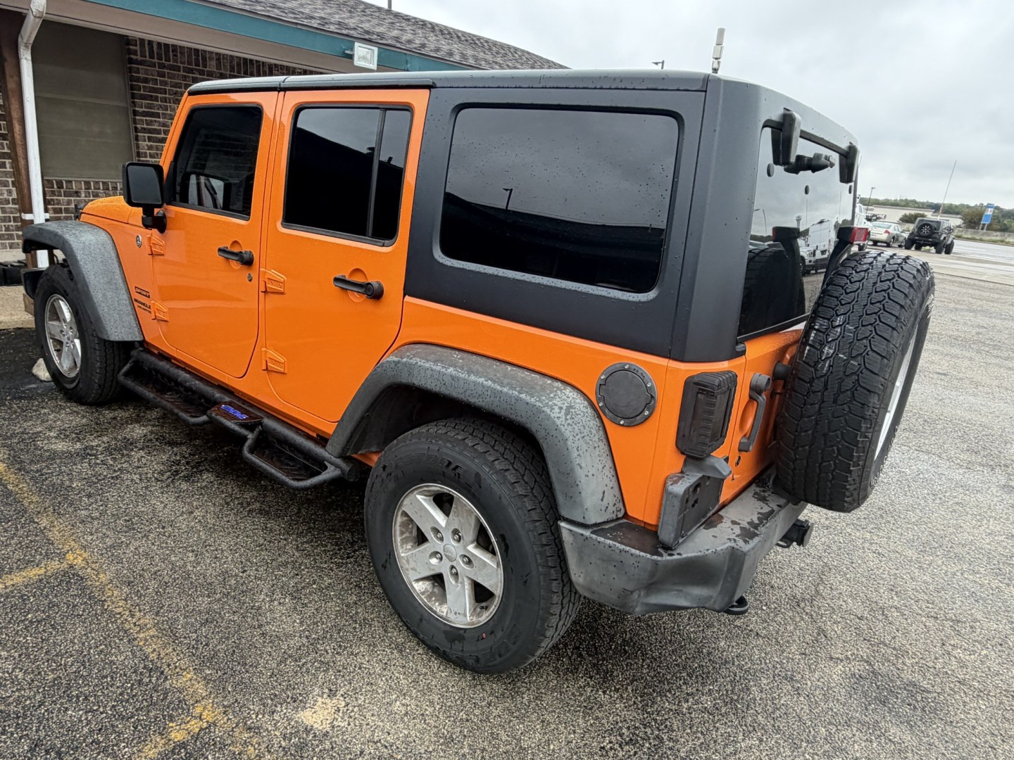 2012 Orange Jeep Wrangler Unlimited Sport 4WD (1C4BJWDGXCL) with an 3.6L V6 DOHC 24V FFV engine, located at 1687 Business 35 S, New Braunfels, TX, 78130, (830) 625-7159, 29.655487, -98.051491- Photo#7