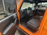 2012 Orange Jeep Wrangler Unlimited Sport 4WD (1C4BJWDGXCL) with an 3.6L V6 DOHC 24V FFV engine, located at 1687 Business 35 S, New Braunfels, TX, 78130, (830) 625-7159, 29.655487, -98.051491- Photo#9