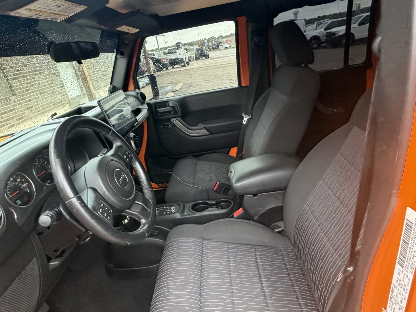 2012 Orange Jeep Wrangler Unlimited Sport 4WD (1C4BJWDGXCL) with an 3.6L V6 DOHC 24V FFV engine, located at 1687 Business 35 S, New Braunfels, TX, 78130, (830) 625-7159, 29.655487, -98.051491- Photo#10