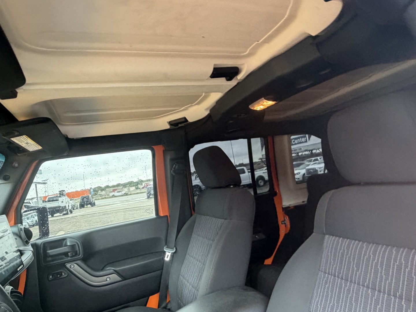 2012 Orange Jeep Wrangler Unlimited Sport 4WD (1C4BJWDGXCL) with an 3.6L V6 DOHC 24V FFV engine, located at 1687 Business 35 S, New Braunfels, TX, 78130, (830) 625-7159, 29.655487, -98.051491- Photo#15
