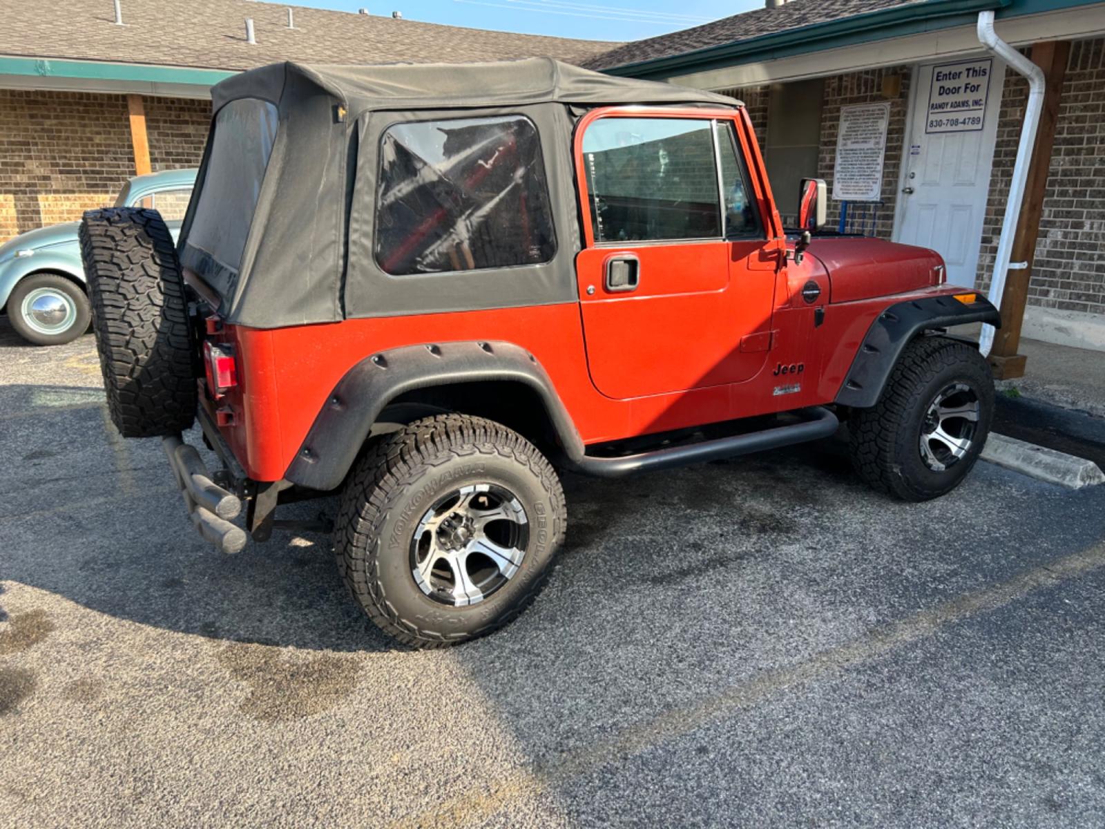 1987 Orange AMC Wrangler Sport (2BCCE81K6HB) with an 350 V8 Chevrolet engine, 4-Speed Automatic transmission, located at 1687 Business 35 S, New Braunfels, TX, 78130, (830) 625-7159, 29.655487, -98.051491 - Photo #2