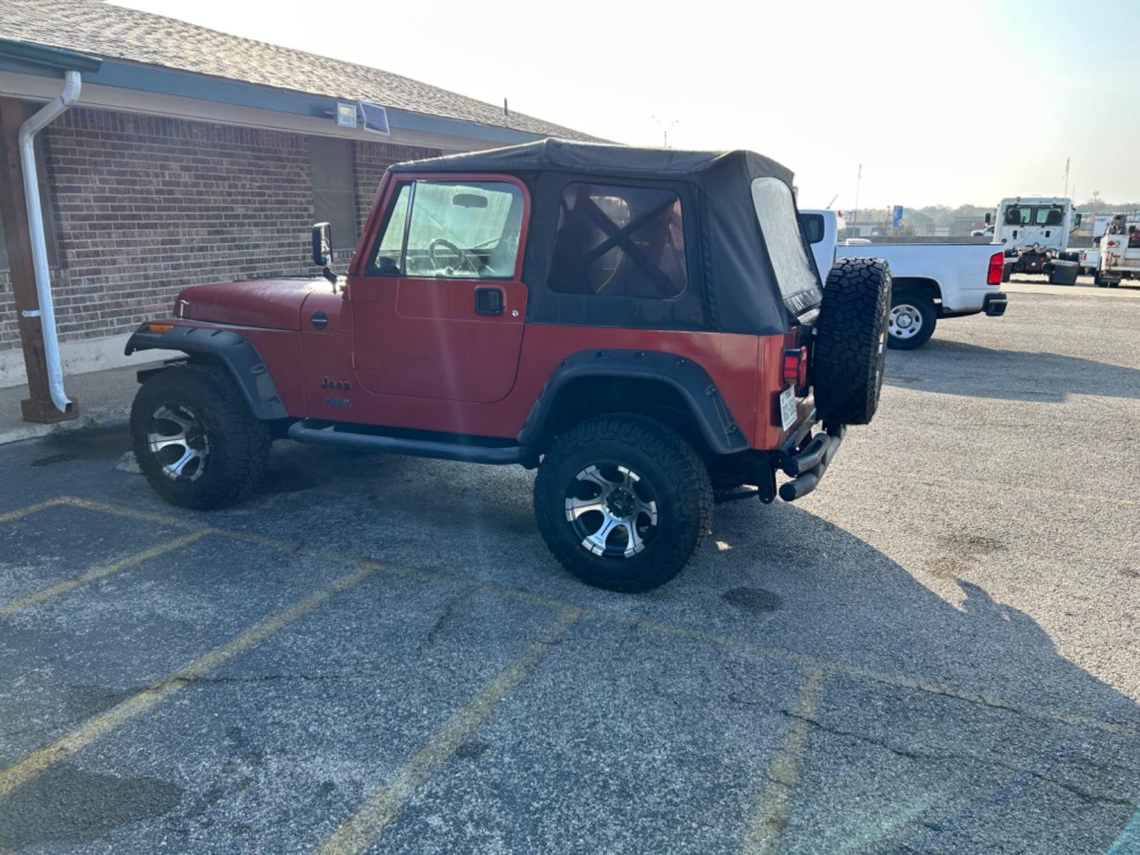 1987 Orange AMC Wrangler Sport (2BCCE81K6HB) with an 350 V8 Chevrolet engine, 4-Speed Automatic transmission, located at 1687 Business 35 S, New Braunfels, TX, 78130, (830) 625-7159, 29.655487, -98.051491 - Photo #3