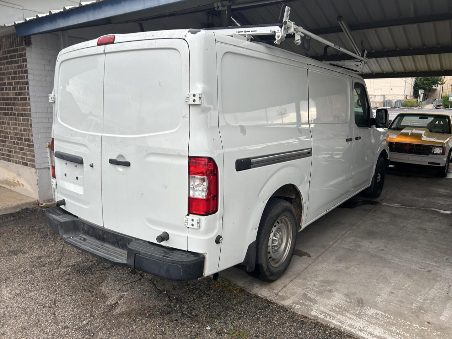 2017 White Nissan NV Cargo (1N6BF0KM1HN) with an 4.0L V6 F DOHC 24V engine, AUTOMATIC transmission, located at 1687 Business 35 S, New Braunfels, TX, 78130, (830) 625-7159, 29.655487, -98.051491 - Photo#2