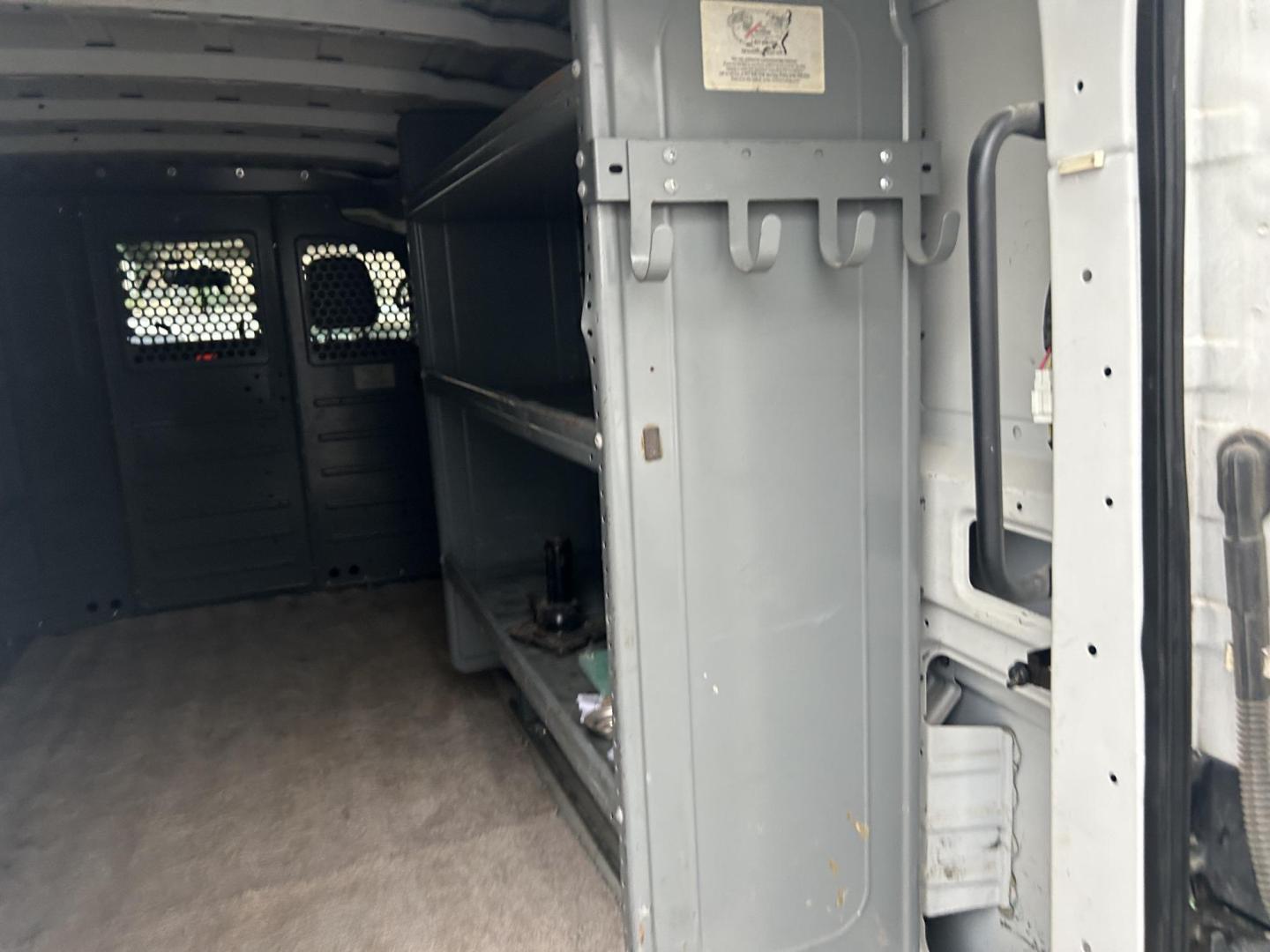 2017 White Nissan NV Cargo (1N6BF0KM1HN) with an 4.0L V6 F DOHC 24V engine, AUTOMATIC transmission, located at 1687 Business 35 S, New Braunfels, TX, 78130, (830) 625-7159, 29.655487, -98.051491 - Photo#9