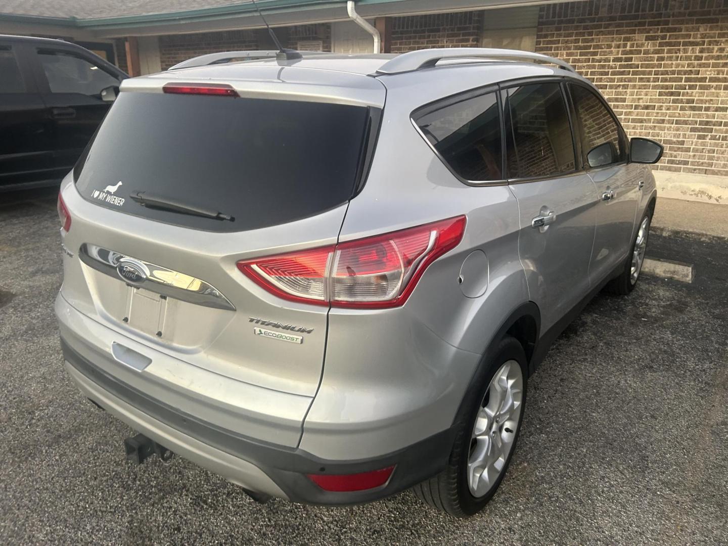 2014 Silver Ford Escape Titanium FWD (1FMCU0J96EU) with an 2.0L L4 DOHC 16V engine, 6-Speed Automatic transmission, located at 1687 Business 35 S, New Braunfels, TX, 78130, (830) 625-7159, 29.655487, -98.051491 - Photo#2